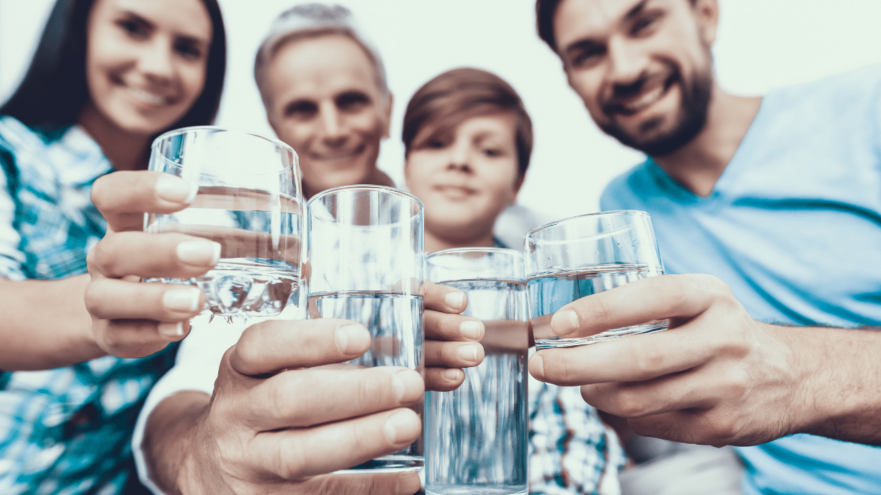 Happy-family-enjoying-pure-water-of-Water-Softener-System-for-Home