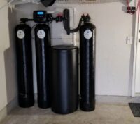 Whole-house filtration and water softening system installed in a San Antonio home.